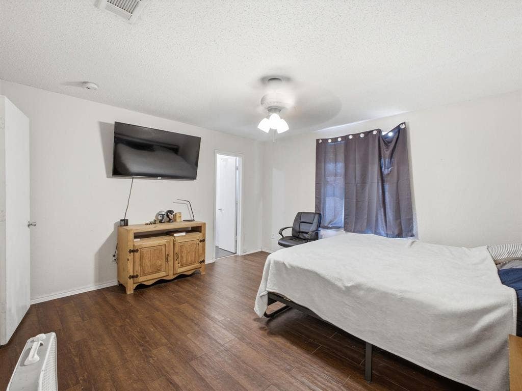2001 Waleska Plaza, Dallas, TX 75211 Wood-finish flooring throughout, white walls, and a ceiling-mounted light fixture