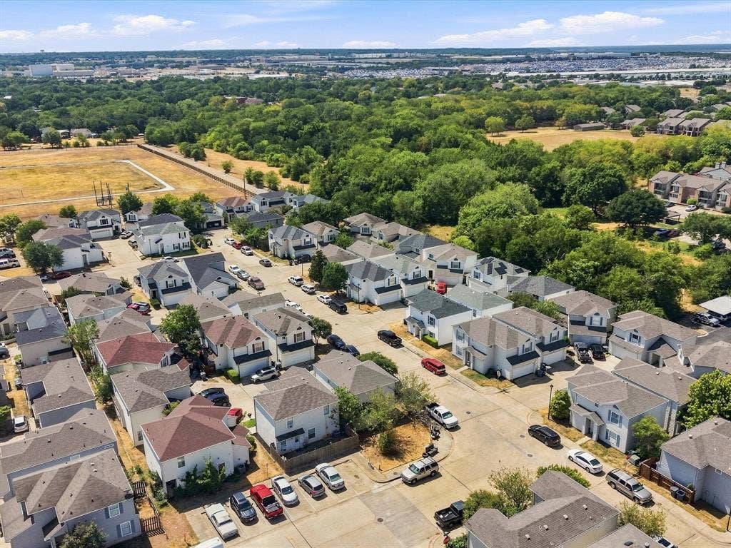 2001 Waleska Plaza, Dallas, TX 75211 Residential neighborhood with multiple two-story homes and tree-lined surroundings