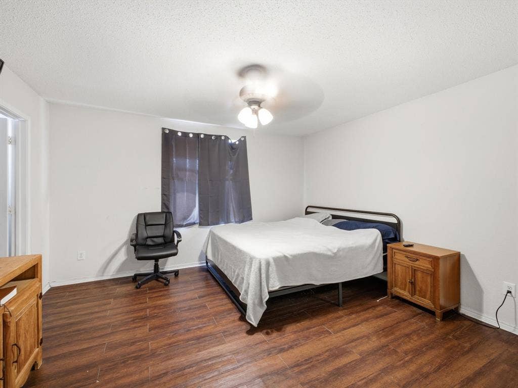 2001 Waleska Plaza, Dallas, TX 75211 Wood-finish flooring throughout, bright white walls, and an overhead ceiling fan with lighting