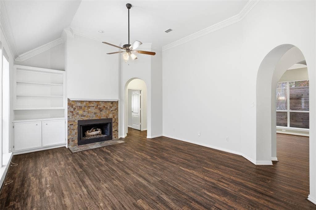 14616 Vintage Lane, Addison, TX 75001 Living space under a soaring vault — stacked-stone fireplace and built-ins already done for you