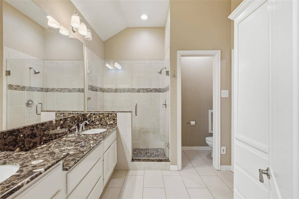 14616 Vintage Lane, Addison, TX 75001 Primary bath: dual granite vanity, oversized walk-in shower and a private water closet