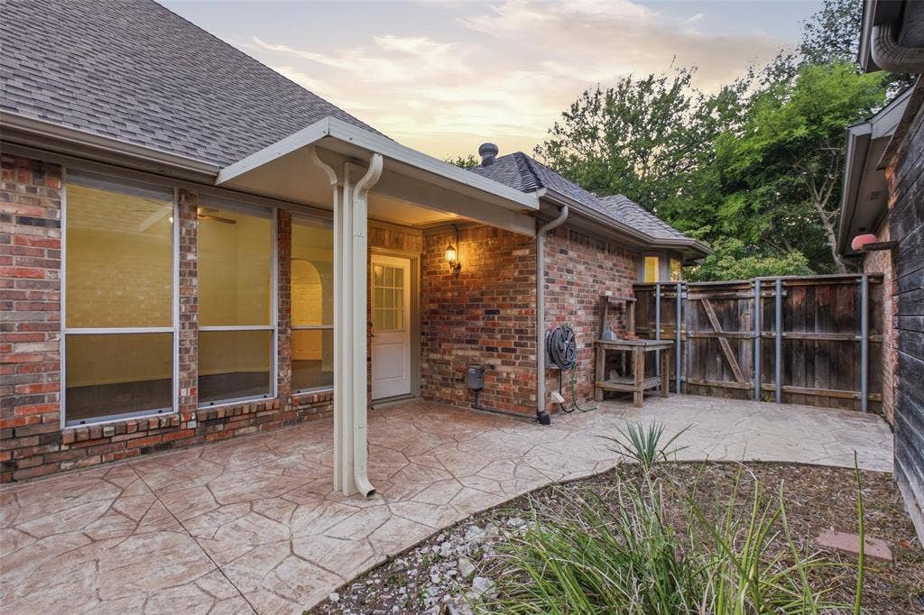 14616 Vintage Lane, Addison, TX 75001 Covered patio steps from the living room — shaded outdoor living you'll use nine months a year