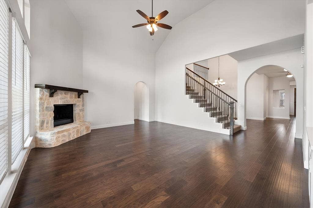 5626 Rutherford Drive, Midlothian, TX 76065 This is where you'll spend your evenings — the stone fireplace is the focal point,