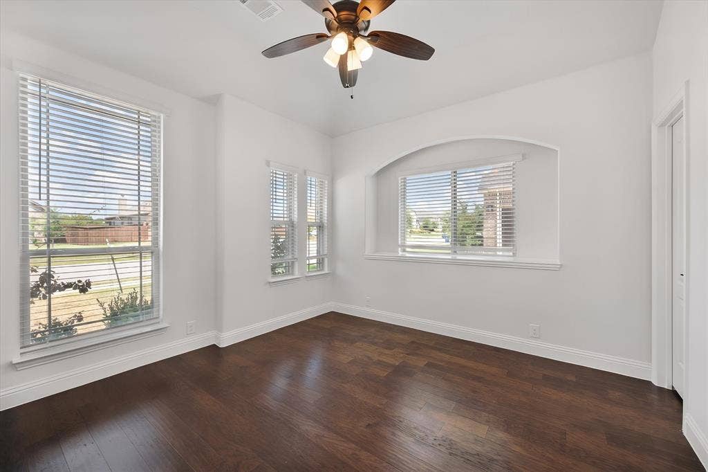 5626 Rutherford Drive, Midlothian, TX 76065 This front room is such a sweet spot — so many windows pouring in natural light, perfect for a home office, a den, whatever you need it to be.