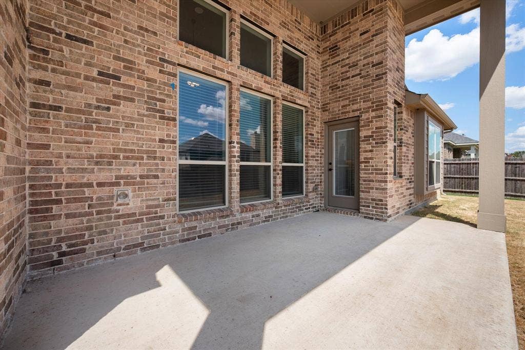 5626 Rutherford Drive, Midlothian, TX 76065 A closer look at the covered patio structure — solid brick, great bones, built to last.