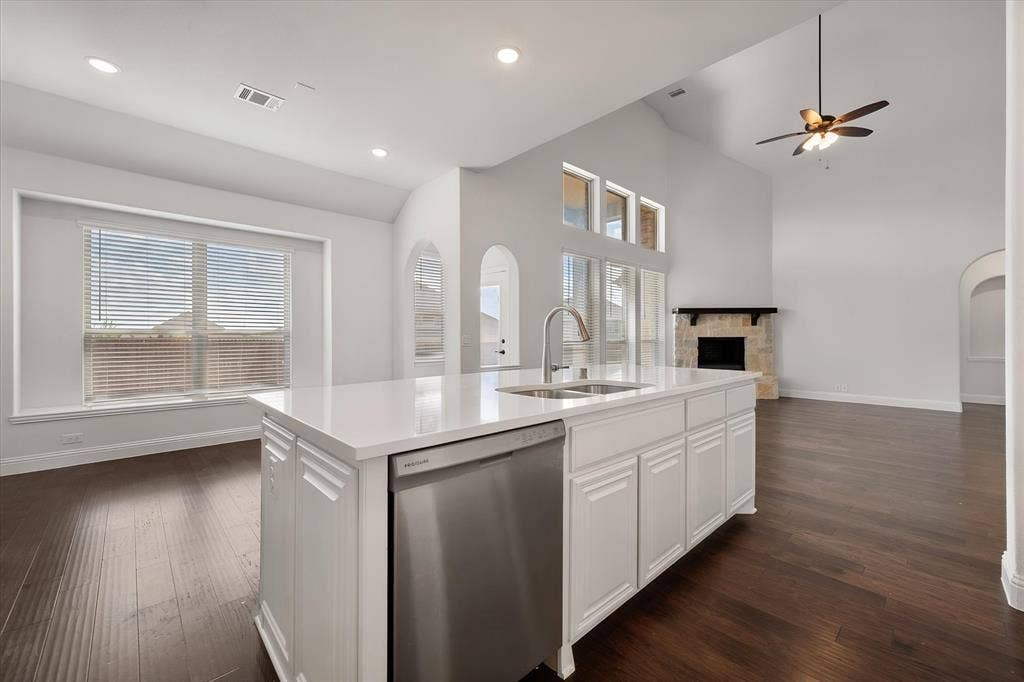 5626 Rutherford Drive, Midlothian, TX 76065 The kitchen offers stainless steel appliances and opens up into the breakfast area.