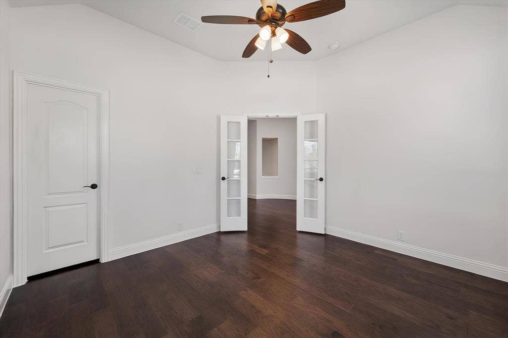 5626 Rutherford Drive, Midlothian, TX 76065 And check out these glass French doors leading into the next room — such an elegant touch, and it lets light travel between spaces.