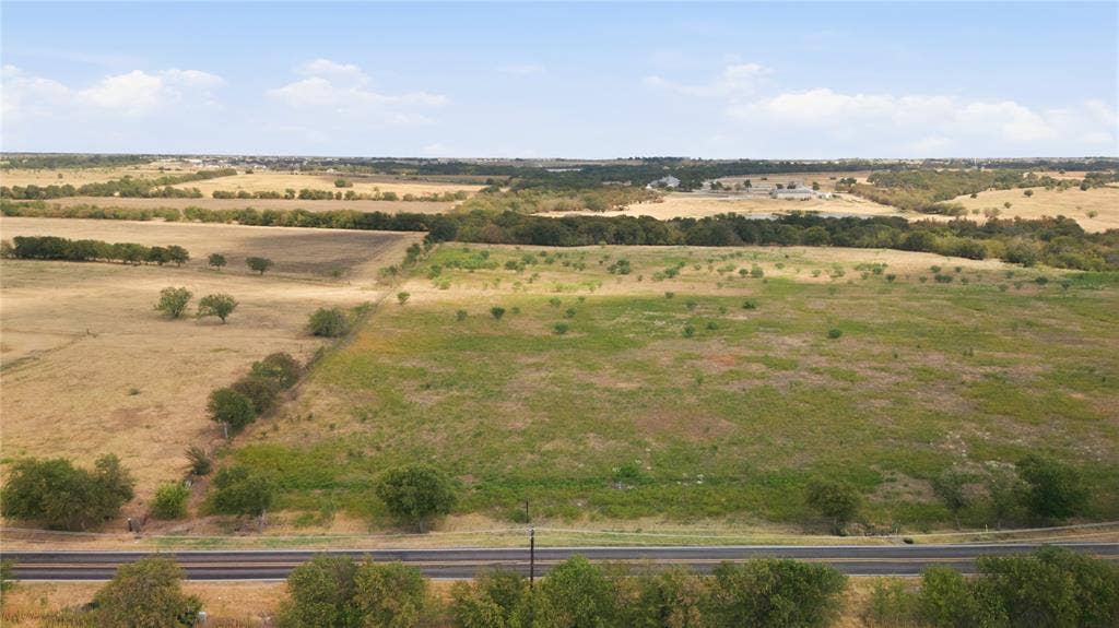 TBD N Louisiana Drive, Celina, TX 75009 Expansive acreage with pastoral fields, scattered mature trees, and a distant tree line