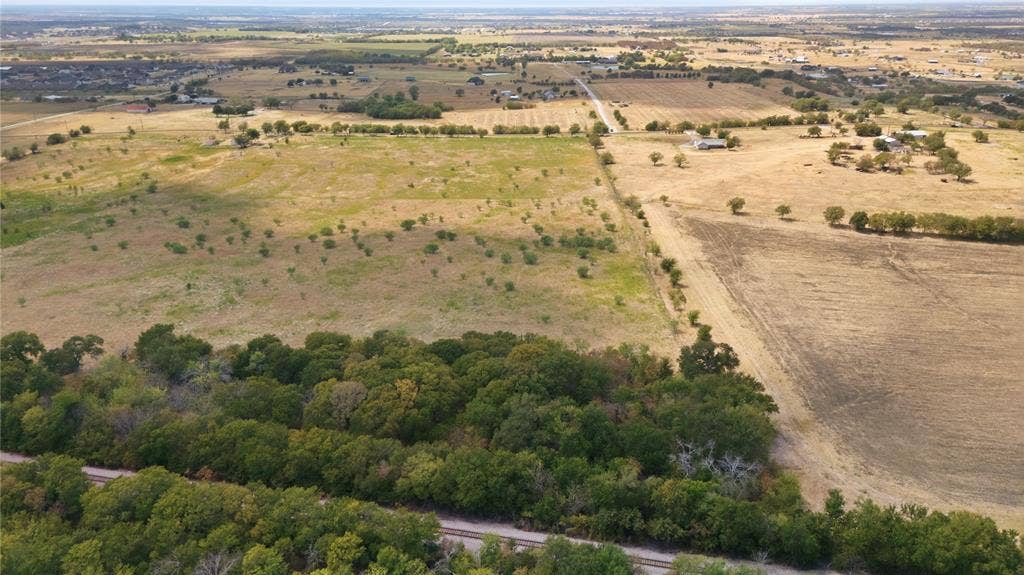 TBD N Louisiana Drive, Celina, TX 75009 Expansive land offering diverse topography, including wooded areas and open fields
