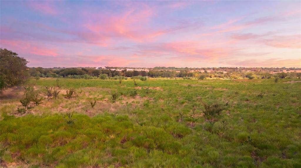 TBD N Louisiana Drive, Celina, TX 75009 Expansive open fields with varied natural vegetation and distant tree lines