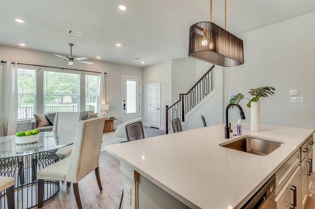505 Mission Trail, #603, Arlington, TX 76010 Kitchen island with a stainless steel sink and matte black faucet
