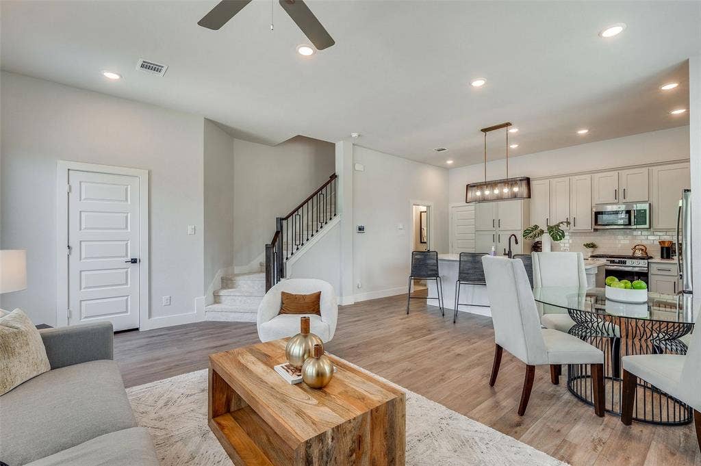 505 Mission Trail, #603, Arlington, TX 76010 Open-concept layout with wood-finish flooring, recessed lighting, and a modern ceiling fan