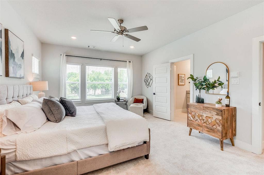 505 Mission Trail, #603, Arlington, TX 76010 Recessed lighting, ceiling fan, large windows with white blinds, light-toned carpeting, and a white paneled door