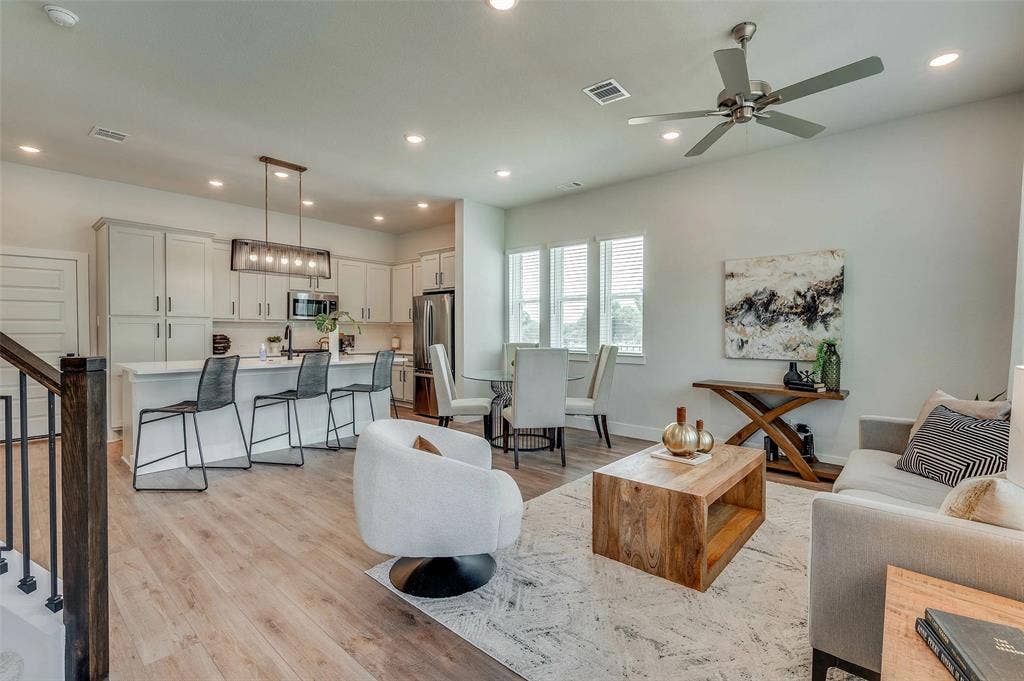 505 Mission Trail, #603, Arlington, TX 76010 Open-concept living space featuring wood-finish flooring, recessed lighting, and a contemporary ceiling fan