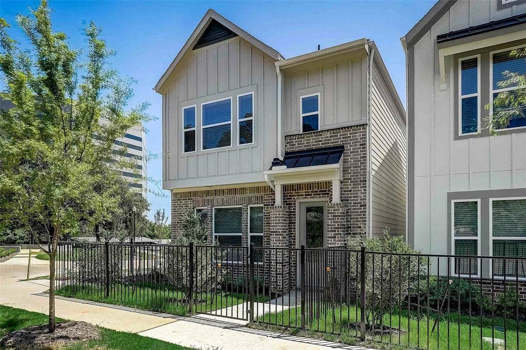505 Mission Trail, #603, Arlington, TX 76010 Contemporary facade featuring board and batten siding and brick accents