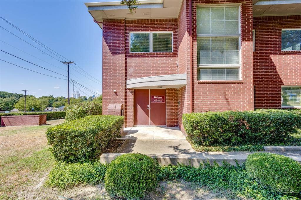 1415 E Belt Line Road, Carrollton, TX 75006 Brick exterior with multiple windows and a covered entry