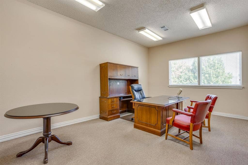 1415 E Belt Line Road, Carrollton, TX 75006 Carpeted flooring, neutral wall paint, overhead lighting, and window with blinds
