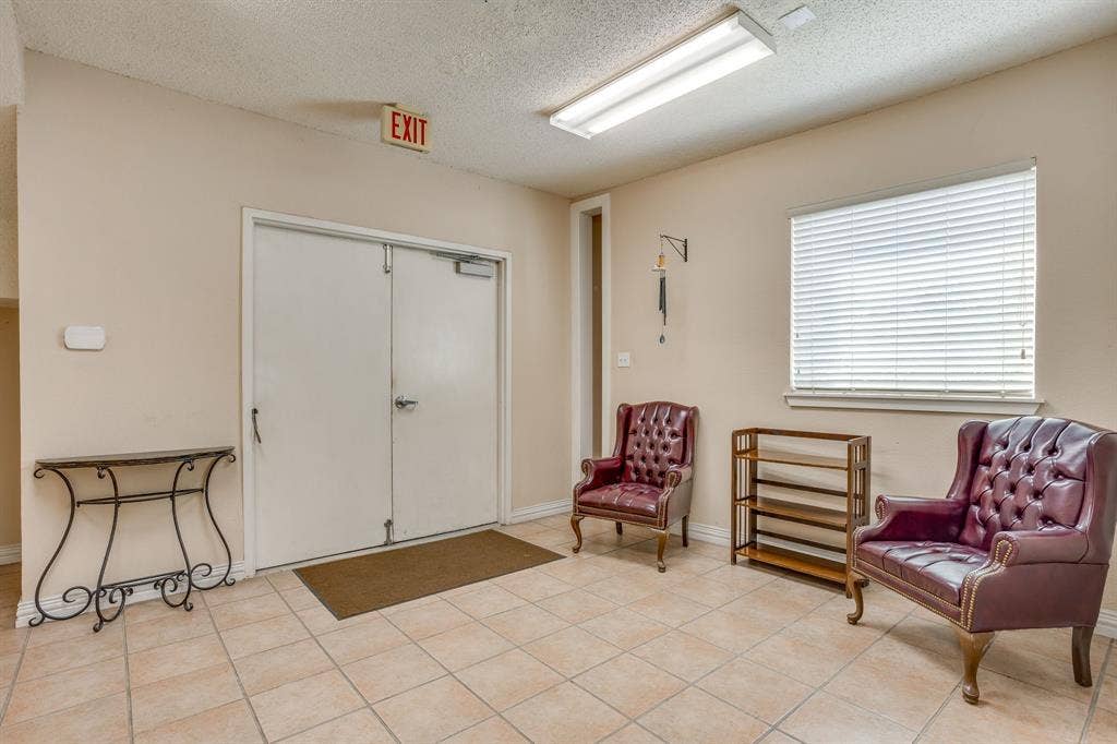 1415 E Belt Line Road, Carrollton, TX 75006 Tile flooring, white double doors, window with blinds, and flush-mount fluorescent lighting