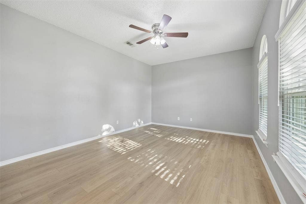 753 Summerfield Drive, Allen, TX 75002 Vaulted ceiling, wood-finish flooring, ceiling fan, multiple windows with blinds, arched transom window