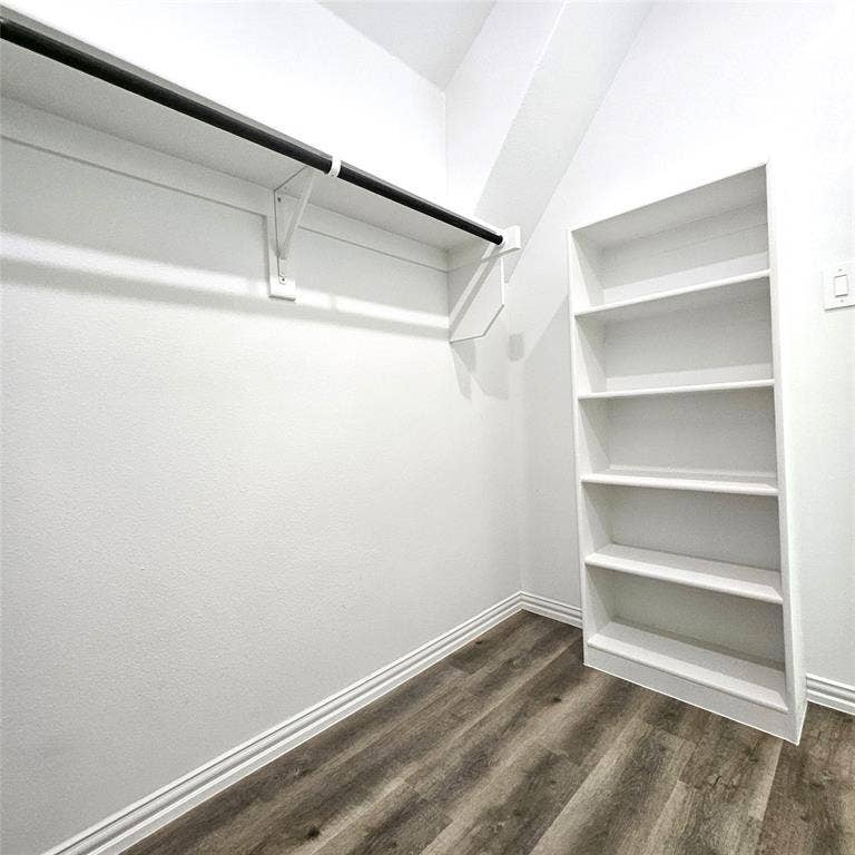2225 Crooked Bow Drive, Mesquite, TX 75149 Built-in shelving, wood-finish flooring, and a clothing rod