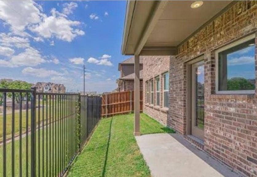 2225 Crooked Bow Drive, Mesquite, TX 75149 Covered concrete patio with brick exterior and recessed lighting