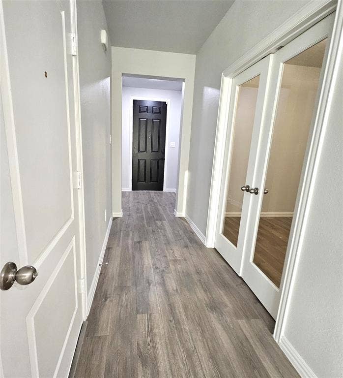 2225 Crooked Bow Drive, Mesquite, TX 75149 Wood-finish flooring throughout, bright white walls, and paneled doors