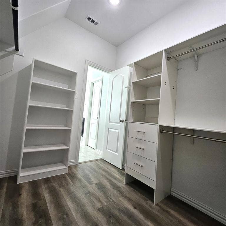 2225 Crooked Bow Drive, Mesquite, TX 75149 Integrated closet system with shelving, built-in drawers, and hanging rods