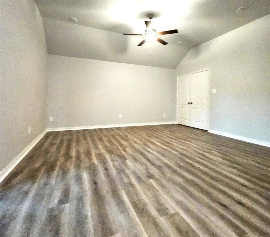 2225 Crooked Bow Drive, Mesquite, TX 75149 Vaulted ceiling with a ceiling fan, wood-finish flooring, recessed lighting, and double-panel doors