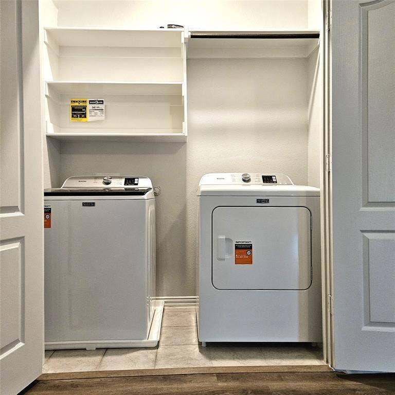 2225 Crooked Bow Drive, Mesquite, TX 75149 Dedicated laundry area with built-in shelving, a clothes rod, and tile flooring