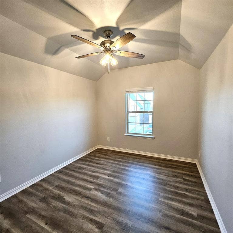 2225 Crooked Bow Drive, Mesquite, TX 75149 Vaulted ceiling featuring a ceiling fan with integrated lighting, wood-finish flooring, and a window with white trim