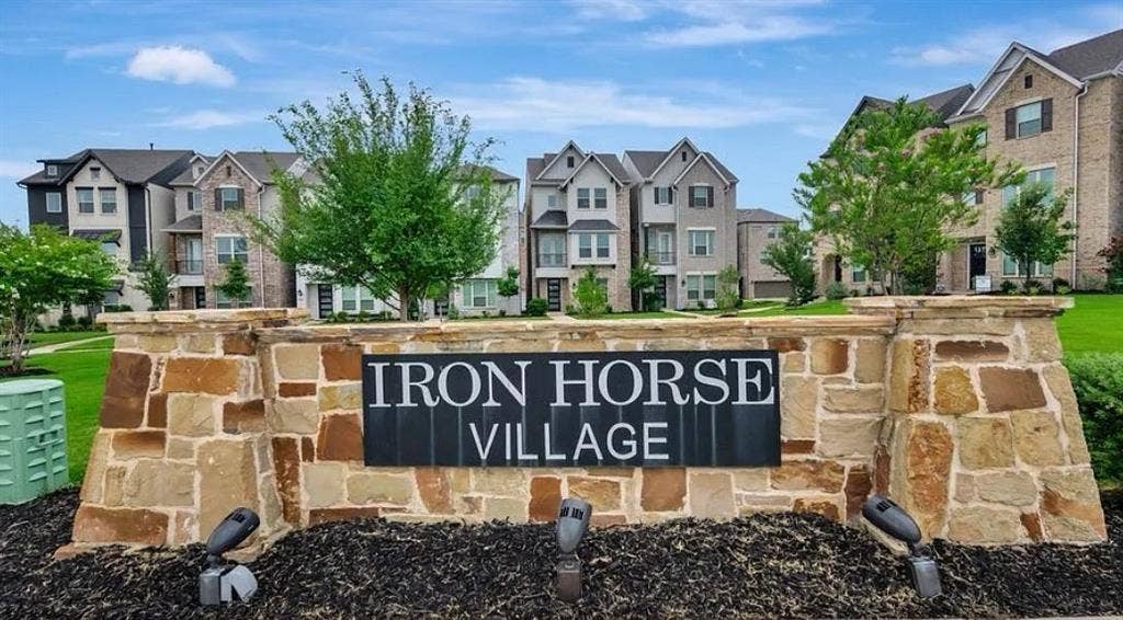 2225 Crooked Bow Drive, Mesquite, TX 75149 Stone and brick entry monument with integrated lighting and planted landscaping