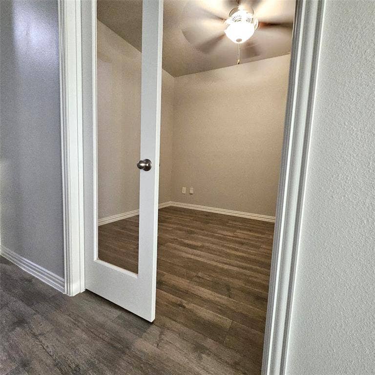 2225 Crooked Bow Drive, Mesquite, TX 75149 Room with wood-finish flooring, ceiling fan, and a glass-paneled entry door