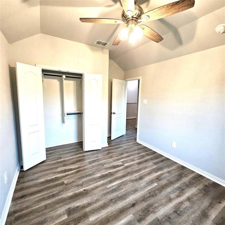 2225 Crooked Bow Drive, Mesquite, TX 75149 Vaulted ceiling, wood-finish flooring, ceiling fan with integrated lighting, bi-fold closet doors, and recessed lighting
