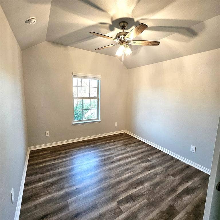 2225 Crooked Bow Drive, Mesquite, TX 75149 Tray ceiling, wood-finish flooring, ceiling fan with integrated lighting, natural light from a window, and neutral wall tones
