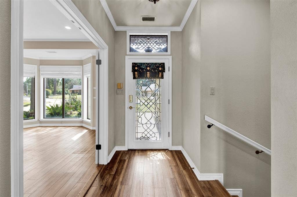 1551 E Tanglewood, Hideaway, TX 75771 Entryway featuring a decorative glass front door, transom window, and wood-finish flooring