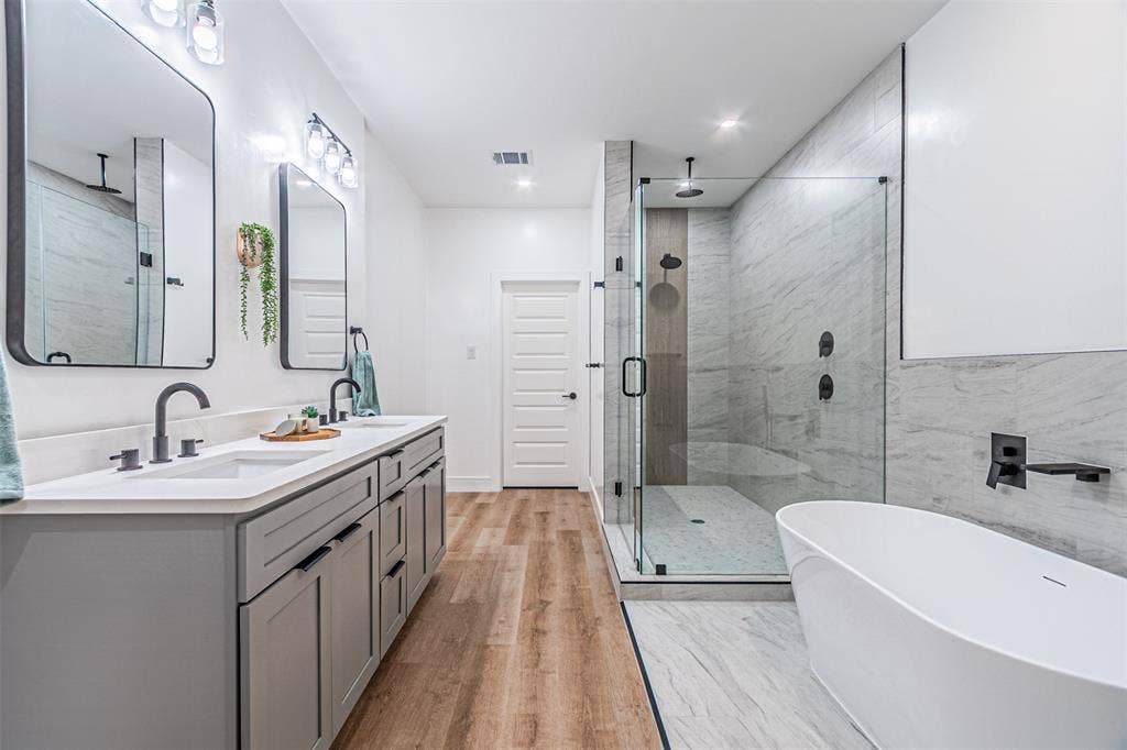 2376 Longhorn Street, #A,B,C,D, Dallas, TX 75228 Main Suite has separate tub from the shower which has 2 heads with from the wall and another from overhead.
