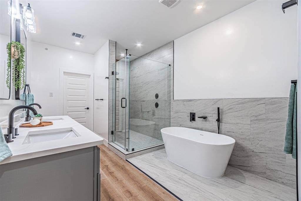 2376 Longhorn Street, #A,B,C,D, Dallas, TX 75228 Tub, shower and dual sinks in a luxurious bathroom from where you walk straight into the master closet