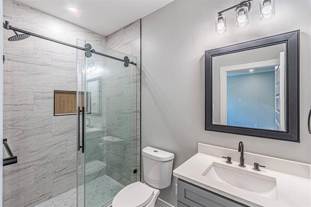 2376 Longhorn Street, #A,B,C,D, Dallas, TX 75228 Standing shower for Secondary rooms have sliding glass doors on heavy duty rails.