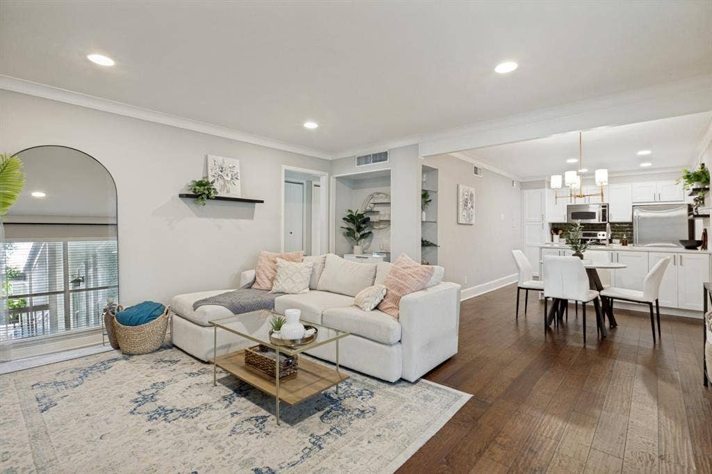 5934 Sandhurst Lane, #208, Dallas, TX 75206 Recessed lighting, wood-finish flooring, built-in shelving, white cabinetry, and stainless steel appliances