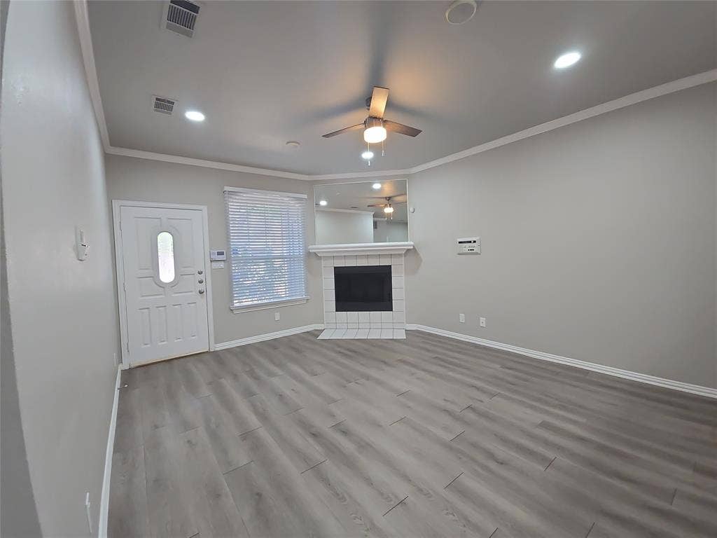 1501 Cedar Elm Drive, #102, Euless, TX 76039 Wood-finish flooring, recessed lighting, and a ceiling fan