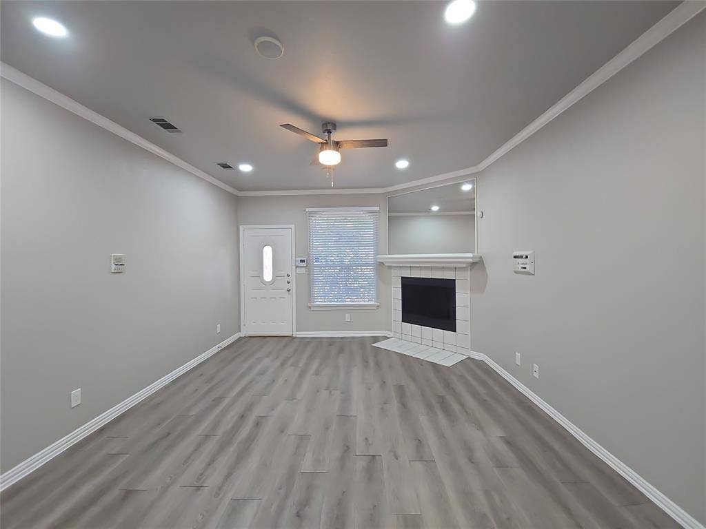 1501 Cedar Elm Drive, #102, Euless, TX 76039 Wood-finish flooring, recessed lighting, and a ceiling fan