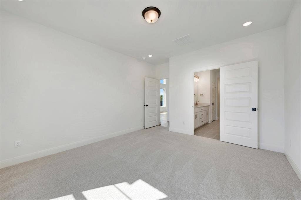 1616 Compass Heights, Mesquite, TX 75181 Neutral-toned carpeting with recessed lighting and a ceiling-mounted light fixture