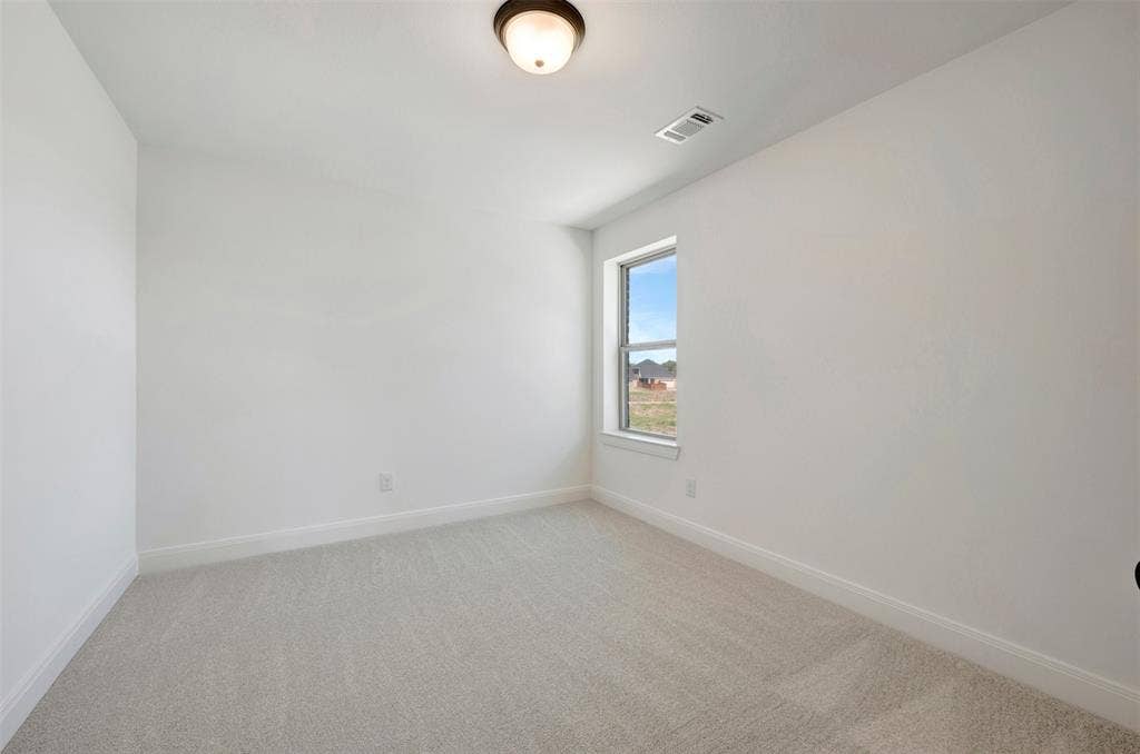 1616 Compass Heights, Mesquite, TX 75181 Recessed window with white trim, light-colored carpeting, white painted walls, and a flush-mount ceiling light fixture