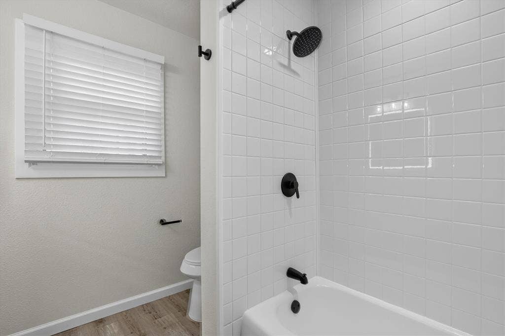 1204 Loma Alta Place, Cleburne, TX 76033 White subway tile shower surround with matte black fixtures
