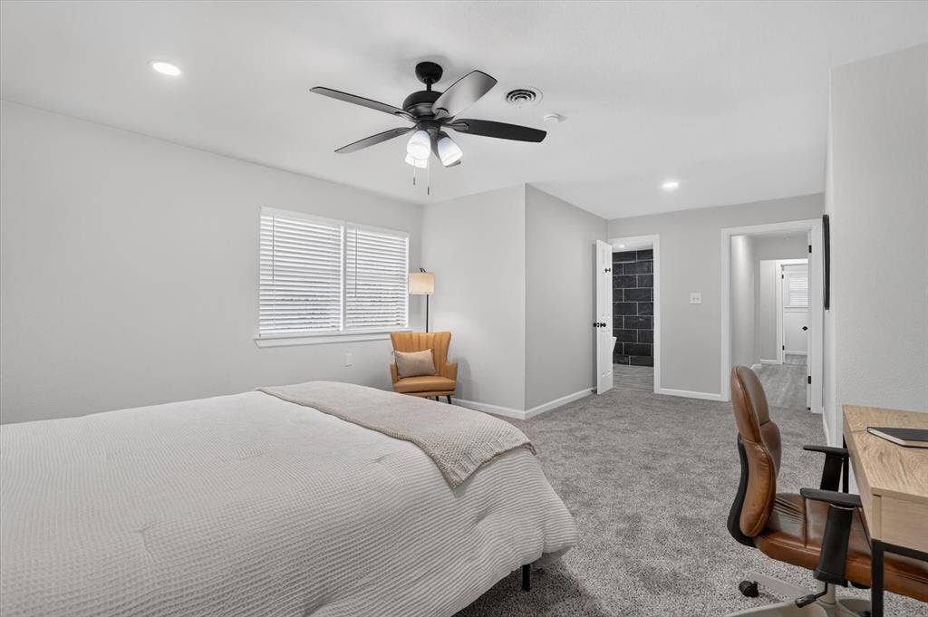 1204 Loma Alta Place, Cleburne, TX 76033 Recessed lighting, ceiling fan with integrated lighting, window with blinds, light gray wall paint, and gray carpet flooring