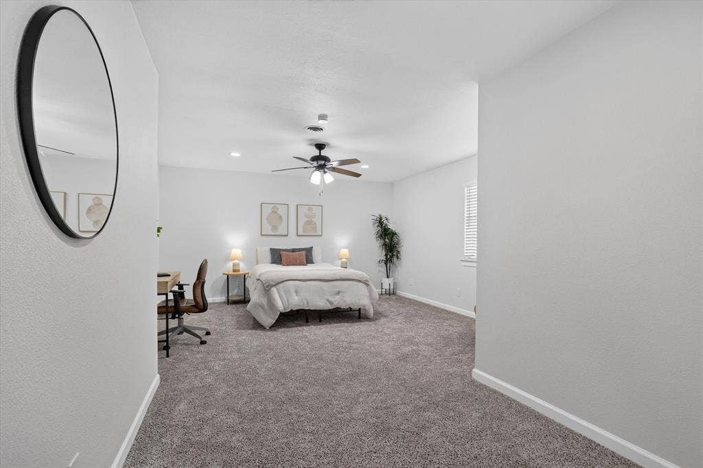 1204 Loma Alta Place, Cleburne, TX 76033 Carpeted bedroom featuring a ceiling fan with integrated lighting, recessed lighting, and a window with blinds