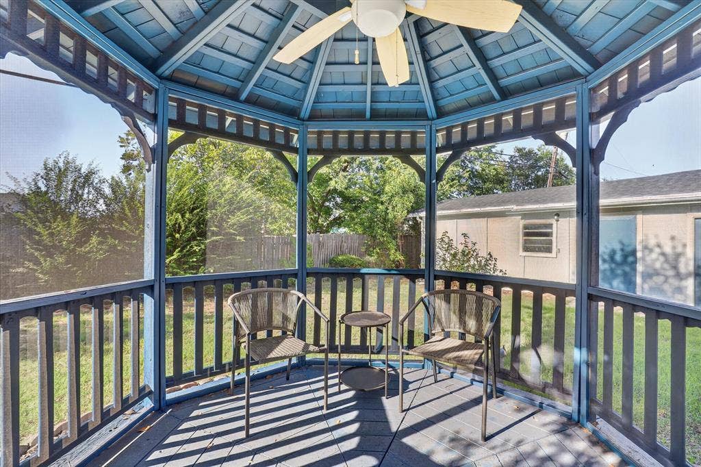 1204 Loma Alta Place, Cleburne, TX 76033 Screened gazebo featuring a ceiling fan, wood flooring, and slatted railing