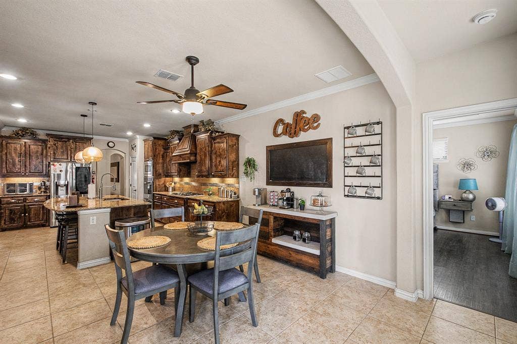 9939 Amberwoods Lane, Frisco, TX 75035 Eat-in Kitchen with Island, double ovens, gas cooktop and lots of storage!