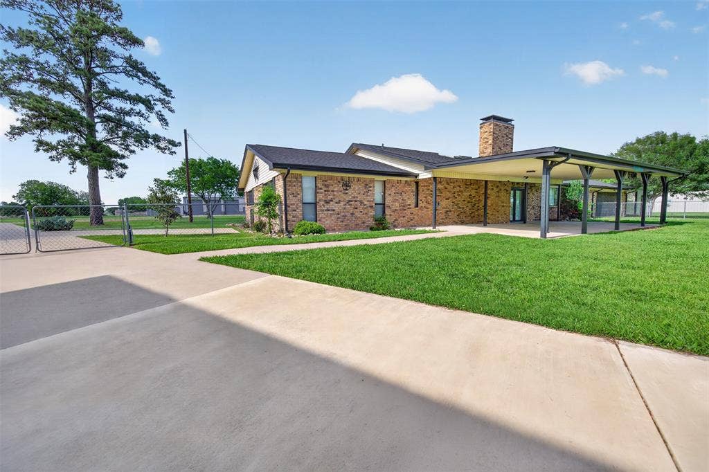 106 Snyder Ranch Road, Trinidad, TX 75163 Huge covered patio looks out to the back yard plus more parking behind the gate.