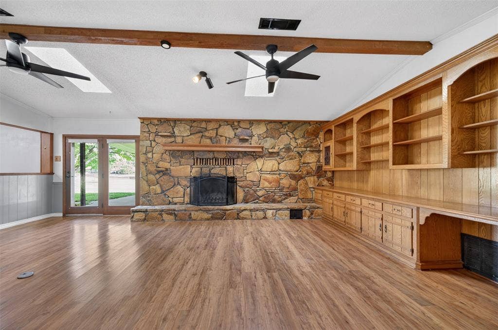 106 Snyder Ranch Road, Trinidad, TX 75163 Living room with massive stone wood-burning fireplace and lots of built-ins